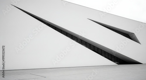 Sharp angular architectural form with strong linear perspective and minimal white surfaces.
