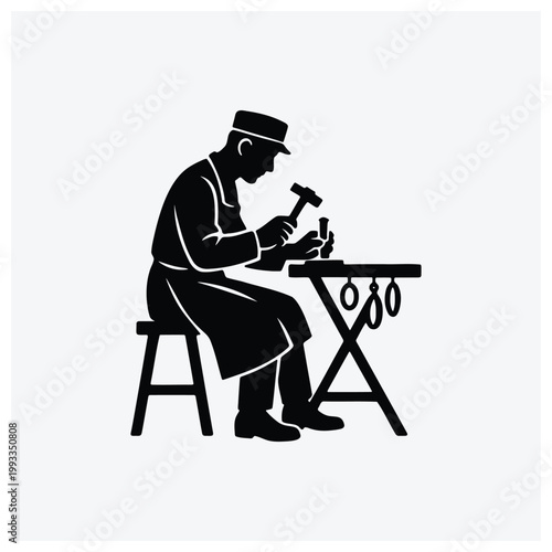 Silhouette of a carpenter or craftsman working at a sawhorse.