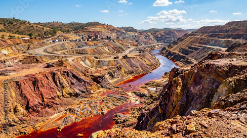 Old rusty metal and iron on red canyon rocks under a blue sky in a desert landscape