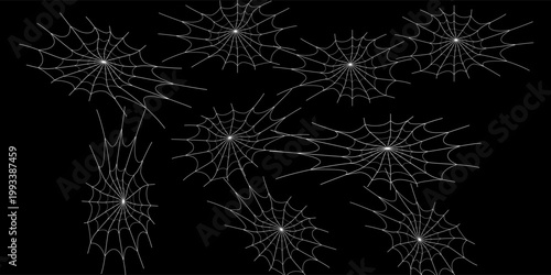 Seamless vector pattern featuring white spider webs of various sizes and styles scattered across a dark black background for Halloween designs.