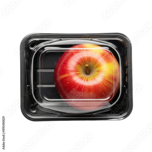 Single Red Apple Packaged in a Black Plastic Tray with a Transparent Lid - Excessive Food Packaging and Plastic Waste Concept