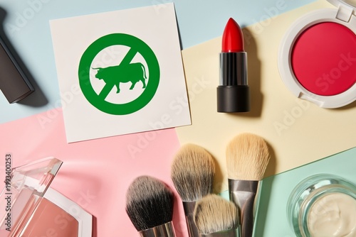 Makeup Tools and Products Displayed With a No Animal Testing Symbol on a Colo...