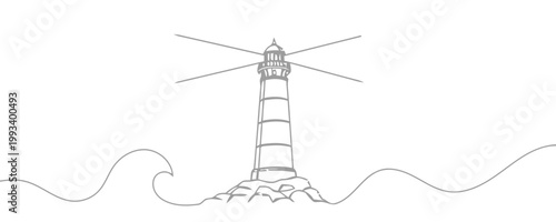 Gray lighthouse on rocky island with waves ocean water