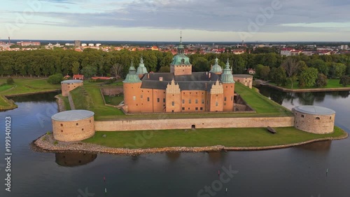 The Renaissance era Kalmar Castle is located in the city of Kalmar, Sweden. Water surrounds the fortified walls and turrets of Kalmar Castle in Sweden. 4K aerial shot