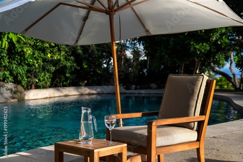 Relaxing by the Pool With a Drink Under an Umbrella at a Sunny Location