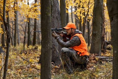 Hunter Aims Rifle at Target in Autumn Forest During Early Morning Light Near ...