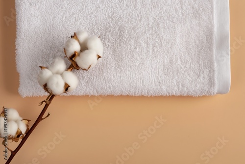 Cotton Stem Placed on a White Towel Against a Light Background in a Simple Se...