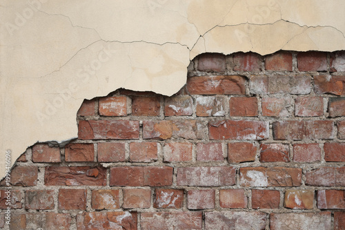 Red background, photo of an old brick wall with peeling plaster