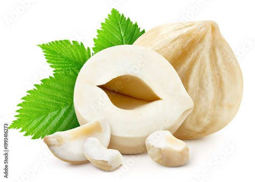 Blanched hazelnut with green leaves and nut pieces isolated on white background