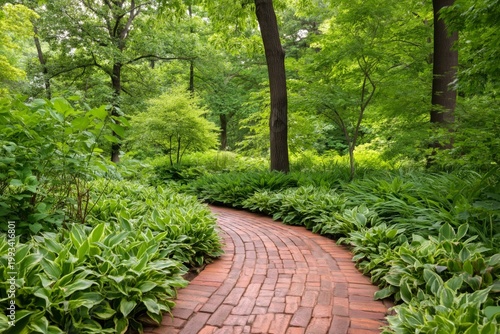 Winding Brick Path in a Lush Green Garden With Tall Trees and Shrubs
