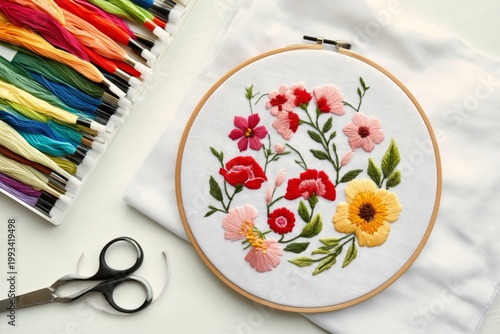 Colorful Flower Embroidery With Threads and Scissors on a White Background