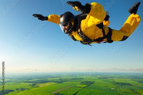 Skydiver Jumps Over Green Fields on a Sunny Day in Open Skies