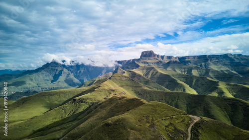 Dramatic South African Drakensberg Ridge Panorama With Sharp Peaks And Alpine Grassland, Sunrise Light