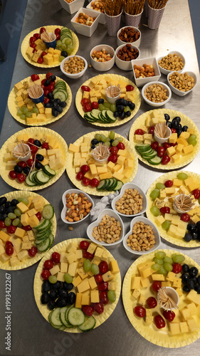 Cheese And Snack Platters With Nuts, Grapes And Vegetables Arranged For Party Or Event Catering