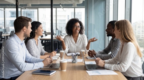 Diverse business team having meeting in modern office, african woman leader speaking, corporate collaboration, project