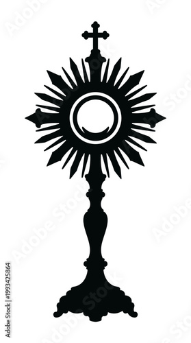 A silhouette of a monstrance, a sacred vessel used in the Catholic Church for displaying the consecrated host