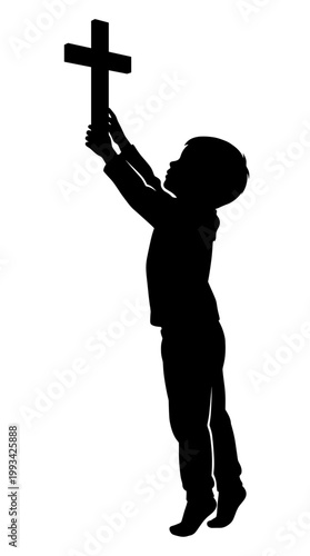 A young child raising a cross, symbolizing faith and hope