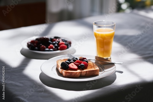 Fresh Breakfast With Toast, Mixed Berries, and Orange Juice on a Sunny Morning