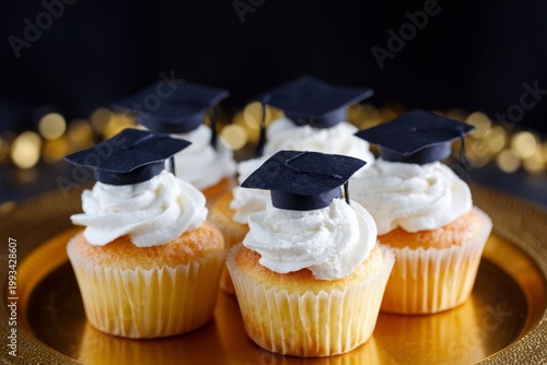Graduation Cupcakes With Small Caps on Top Served at a Celebration Event