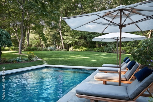 Relaxing by the Pool in a Backyard With Shade From Umbrellas and Green Trees ...