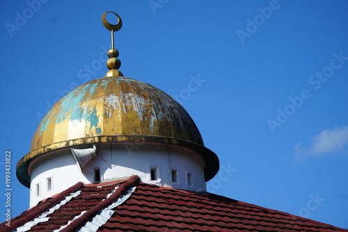 Canvastavla Ancient weathered gold mosque dome with patina, featuring a crescent moon and star finial