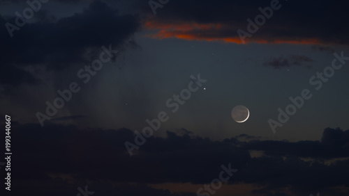 Billede på lærred Blue hour time with crescent Moon, stars and planets.