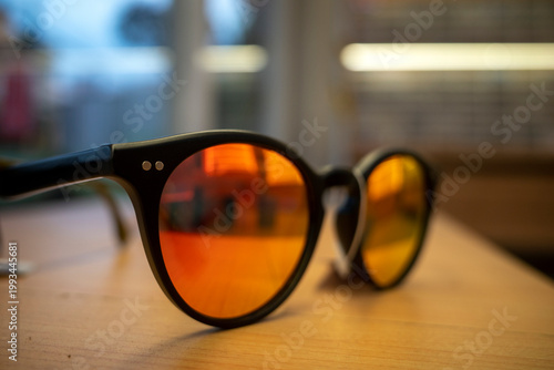 Close up of a sun glasses with unique color on a eyeglass shop, shallow focus