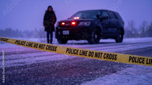 Young adult woman standing near police vehicle at winter crime scene investigation in snow.