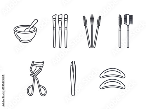 Collection of beauty tools for makeup and eyelash application.