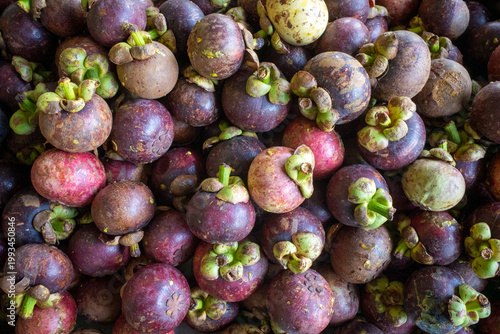 Fresh ripe purple mangosteens, Manggis (Garcinia mangostana L.) for natural background
