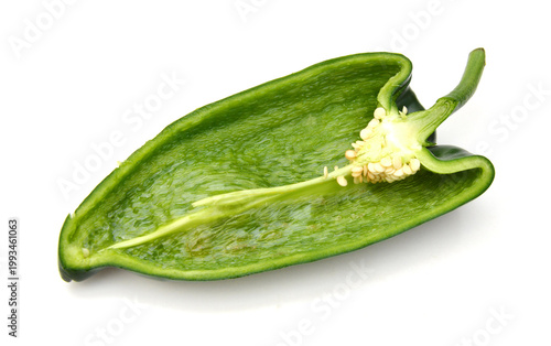 Stack dark green poblano peppers isolated on white