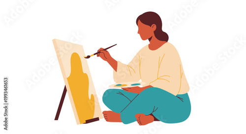 A woman sitting and painting on an easel with a brush