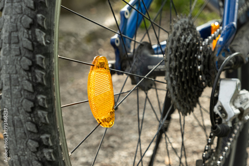 Wallpaper Mural Orange spoke reflector on a bicycle wheel close up. Torontodigital.ca