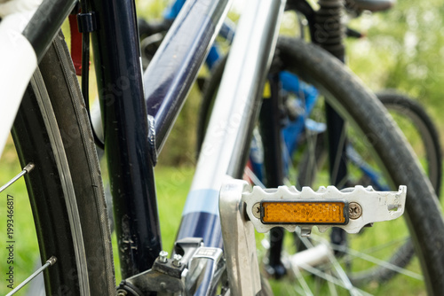 Wallpaper Mural Close-up of an orange safety reflector on a bicycle pedal. Torontodigital.ca
