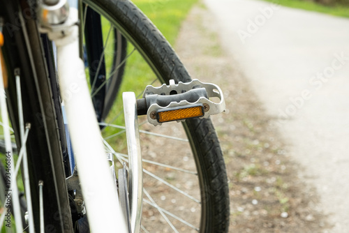 Wallpaper Mural Close-up of an orange safety reflector on a bicycle pedal. Torontodigital.ca