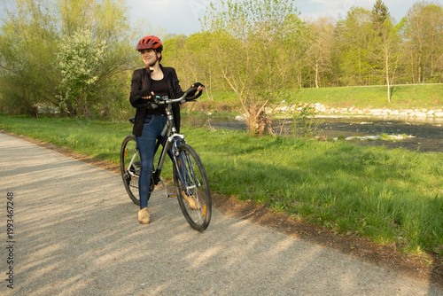 Wallpaper Mural Fitness and recreation, young woman enjoying a bicycle ride in the spring park Torontodigital.ca