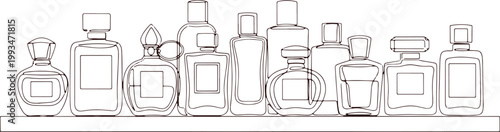 Collection of perfume bottles on shelf elegant glass bottles for fragrance products.