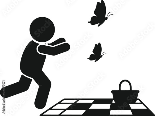 Person running to catch butterflies near picnic blanket.