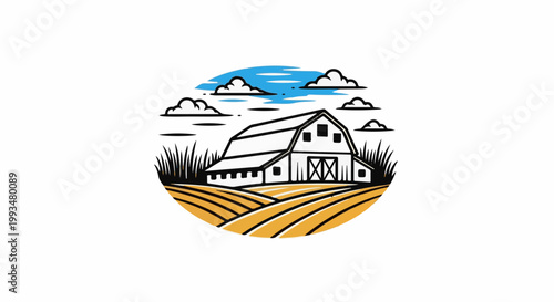 Rustic barn nestled in golden fields under a cloudy sky