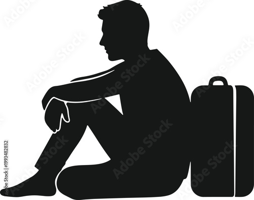 Man sitting with suitcase looking thoughtful about journey or departure.