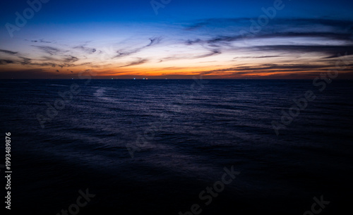 Beautiful Light Sunset or sunrise over sea,Aerial view scenery Sky with Amazing clouds and waves in sunset sky nature light cloud background