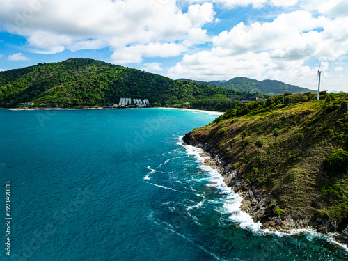 Aerial flying drone view seashore waves water surface texture in sunny tropical ocean at Phuket island Thailand