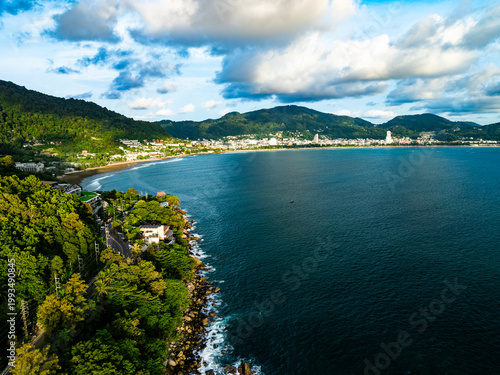 Aerial flying drone view seashore waves water surface texture in sunny tropical ocean at Phuket island Thailand