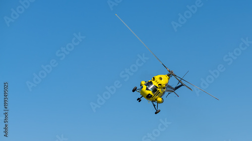 yellow helicopter in flight