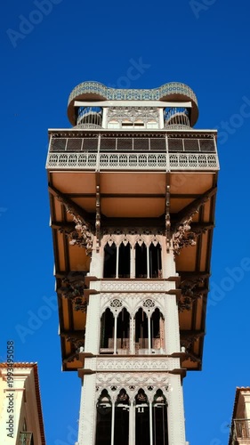 Close-up of historic Santa Justa elevator under blue sky, Lisbon