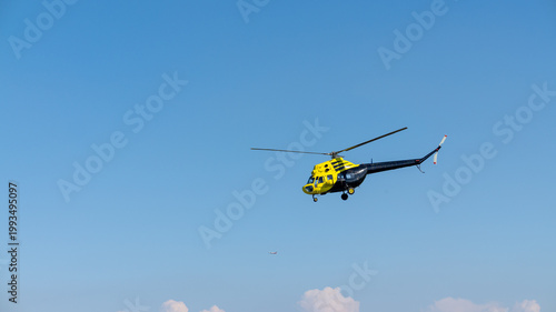 helicopter flying over the sky