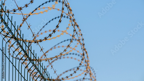 barbed wire fence with blue sky