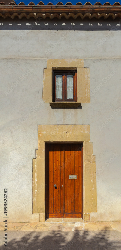 Fototapeta premium Elements of architecture of buildings, antique doors and gates with bars. On the streets in Catalonia, public places.