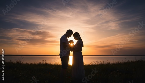 Silhouetted Couple Holding Hands at Sunset by Water