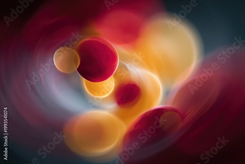 Colored spheres floating and glowing in swirling background